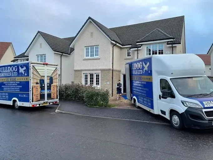 Branded vans outside a house during a clearance in central Scotland
