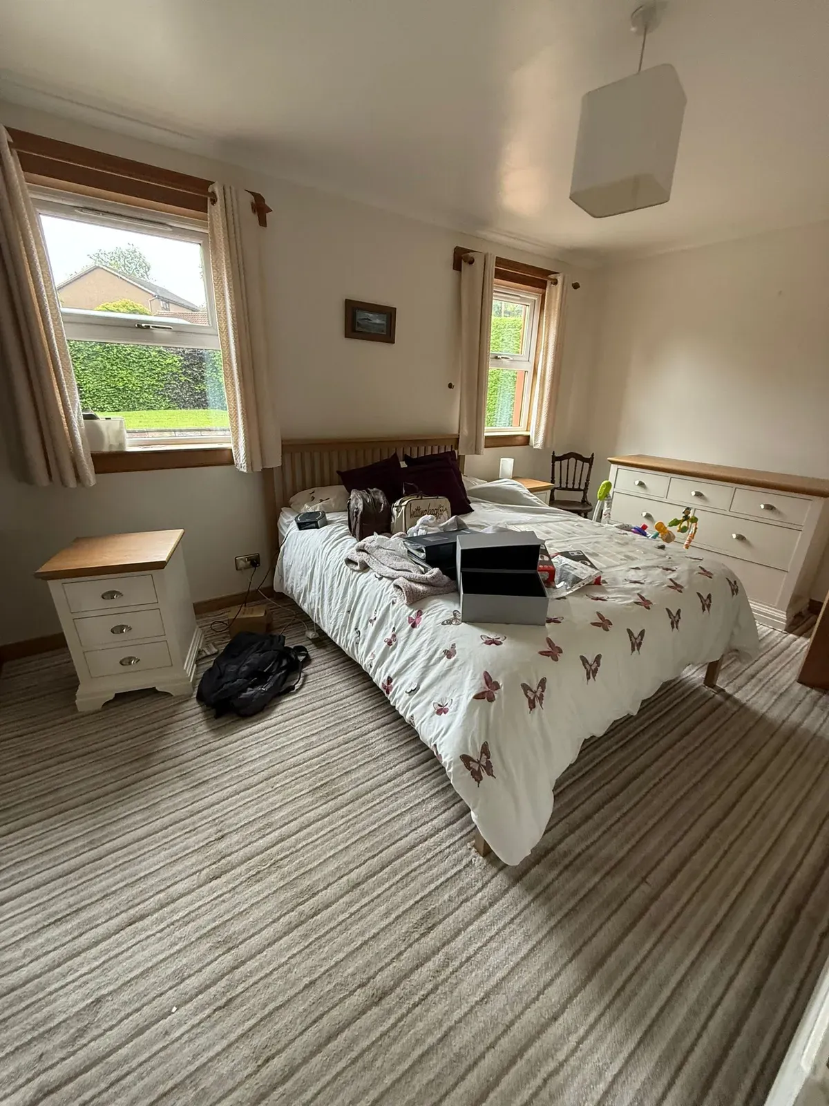 A lived-in bedroom with personal belongings before a sensitive clearance