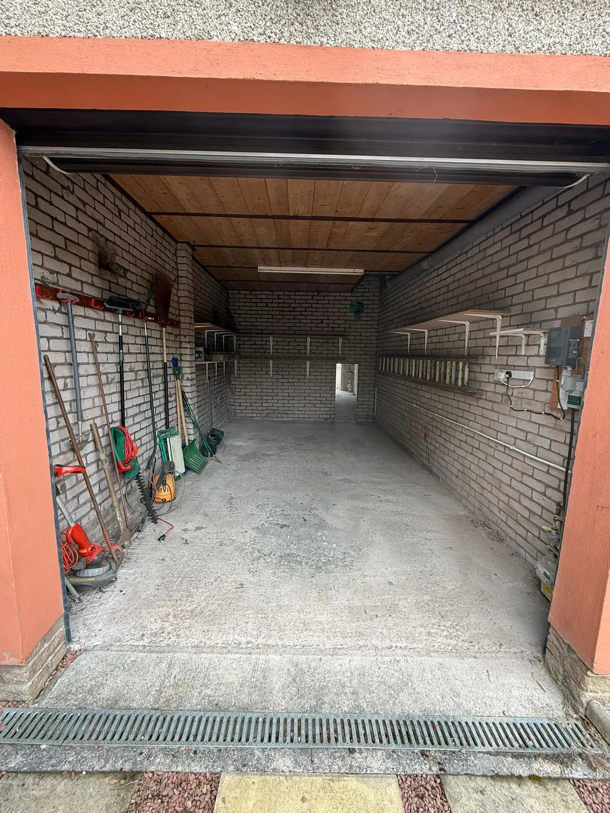 A cleared, swept-out garage space