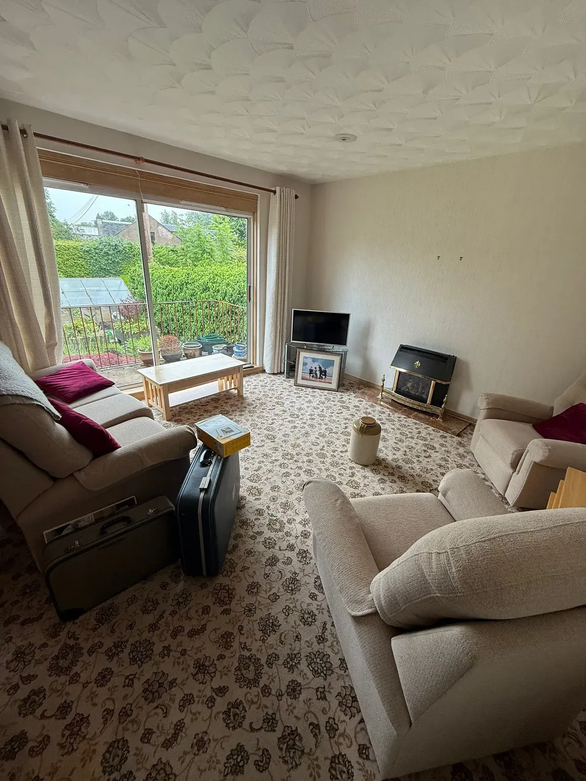 A furnished living room before a full house clearance
