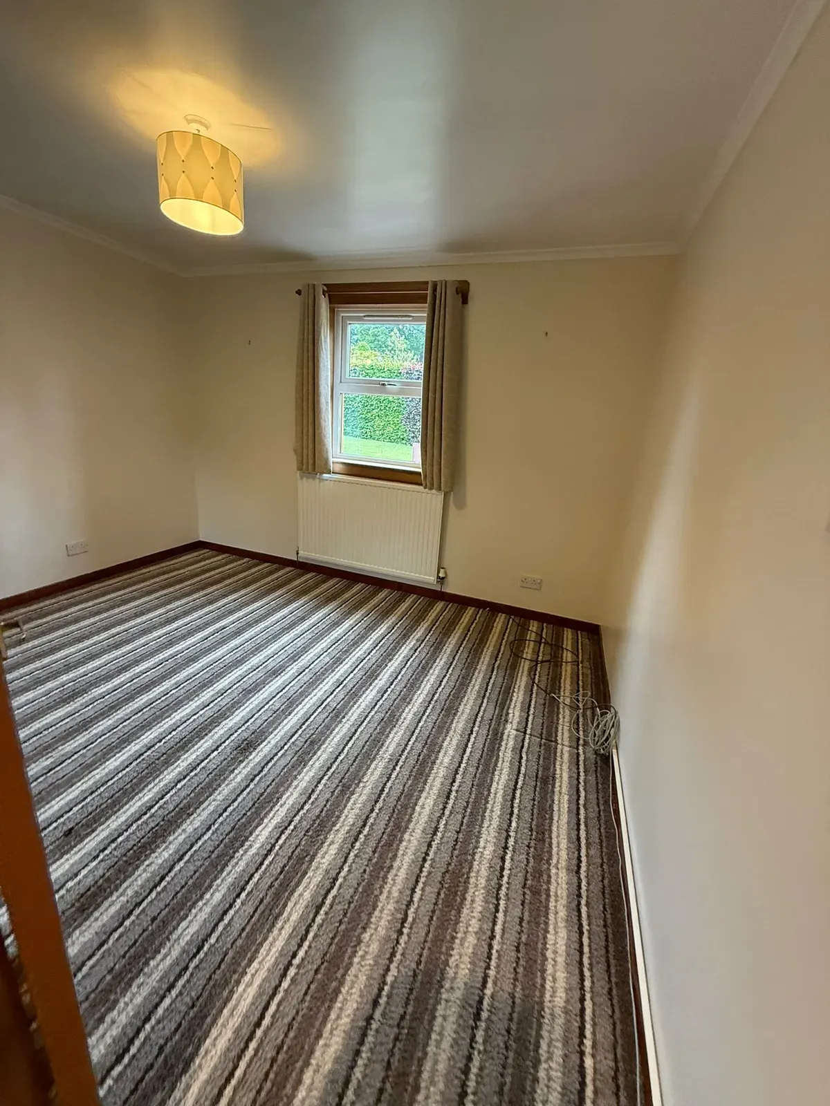 A calm, tidy bedroom cleared with care